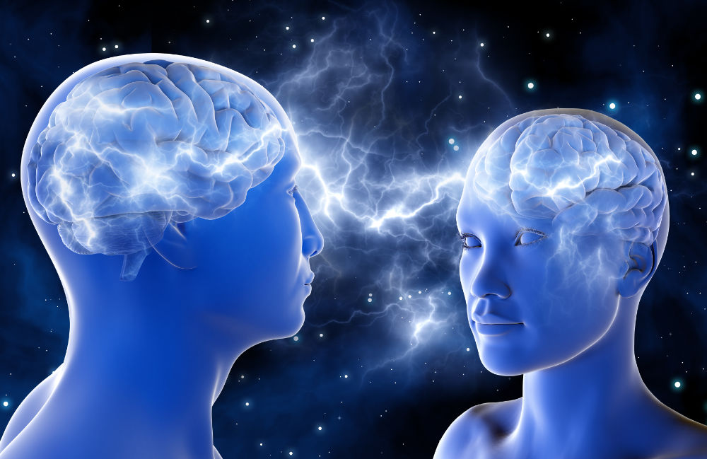 Das Foto illustriert anhand von zwei Köpfen, das beim Hineinführen in eine andere Person Spiegelneuronen aktiv werden. 